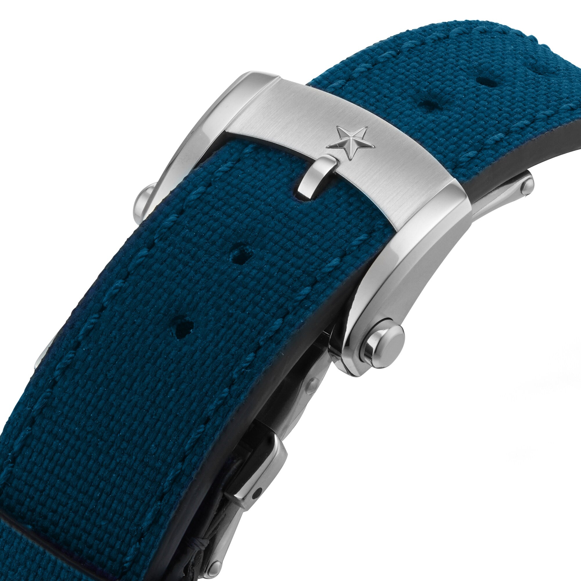 Close-up of a stainless steel Zenith Chronomaster Sport buckle with star engraving, fitted to a textured teal fabric strap—an elegant accent befitting this automatic chronograph.