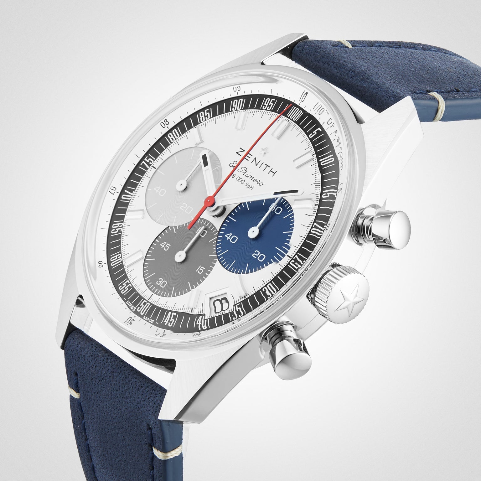 The Zenith Chronomaster EP Original is a stainless steel watch with a blue leather strap, El Primero 3600 movement, tricolour dial (grey, blue, silver subdials), and a white tachymeter bezel.