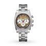 The Zenith Chronomaster Revival El Primero A384 is a stainless steel wristwatch with a tonneau-shaped case, silver and brown gradient dial, two white subdials, date window at 4:30, and a metal link bracelet, shown on a white background.