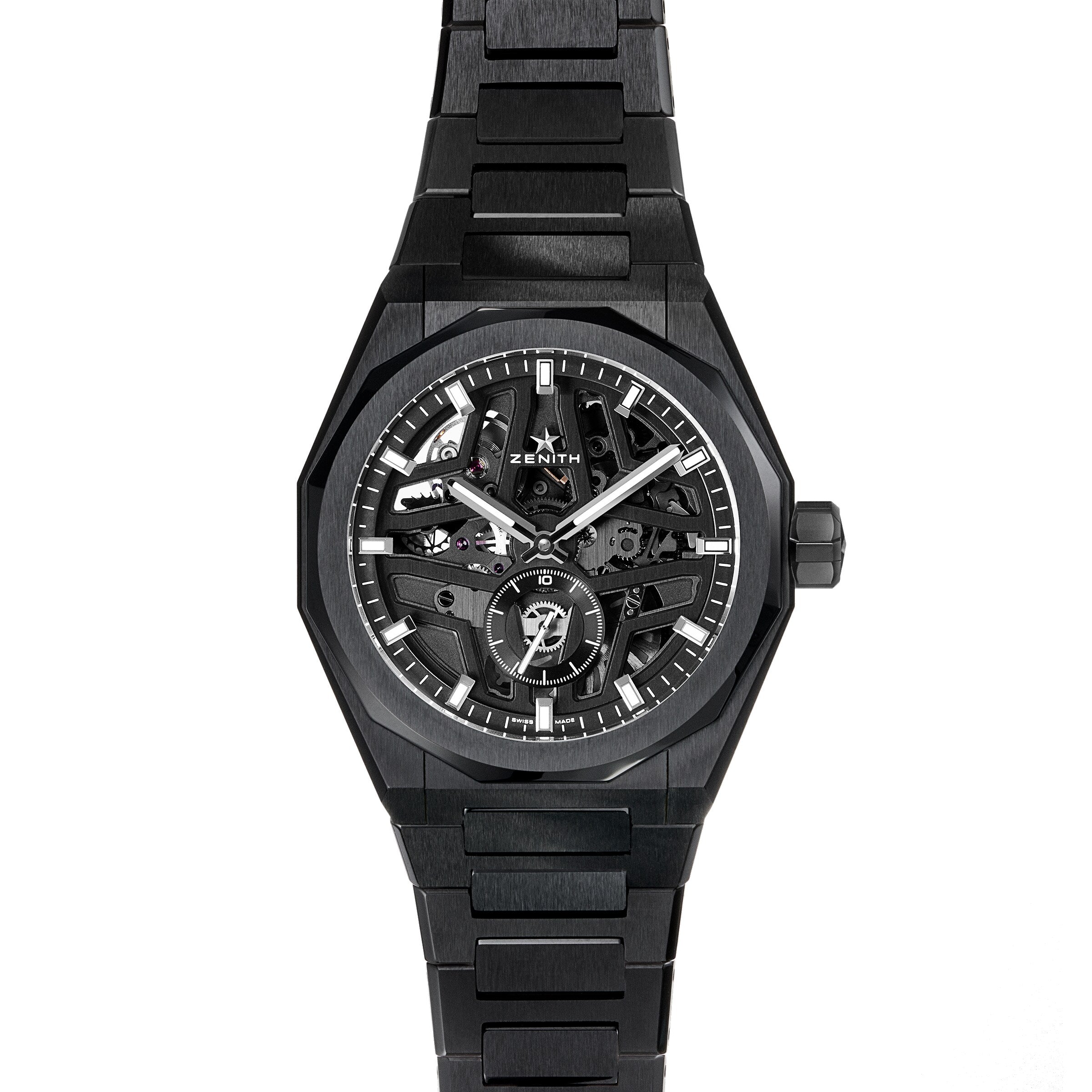 The black Zenith Defy Skyline Skeleton wristwatch, featuring a skeleton dial, silver hour markers, and a metal link bracelet, stands out with urban style and displays its high-frequency automatic movement against a white background.