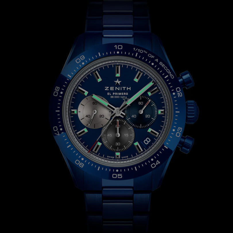 The Zenith Limited Edition Chronomaster Sport 160th Anniversary features a blue dial, three subdials, tachymeter bezel, and metal bracelet, highlighting high-frequency timekeeping, front view on a black background.