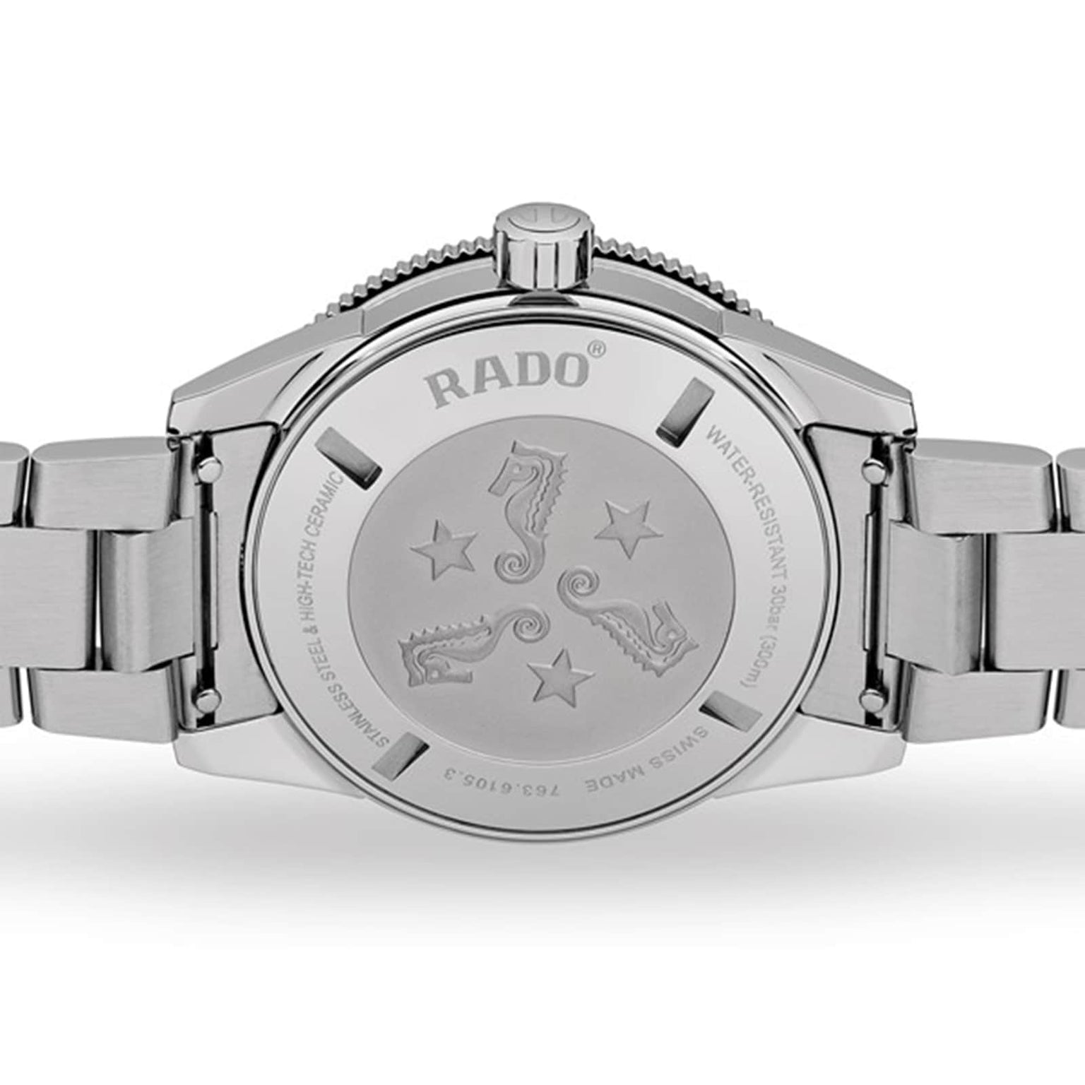 The back of the Rado Captain Cook Automatic watch showcases engraved seahorses, stars, and text highlighting its water resistance and Swiss-made vintage design.