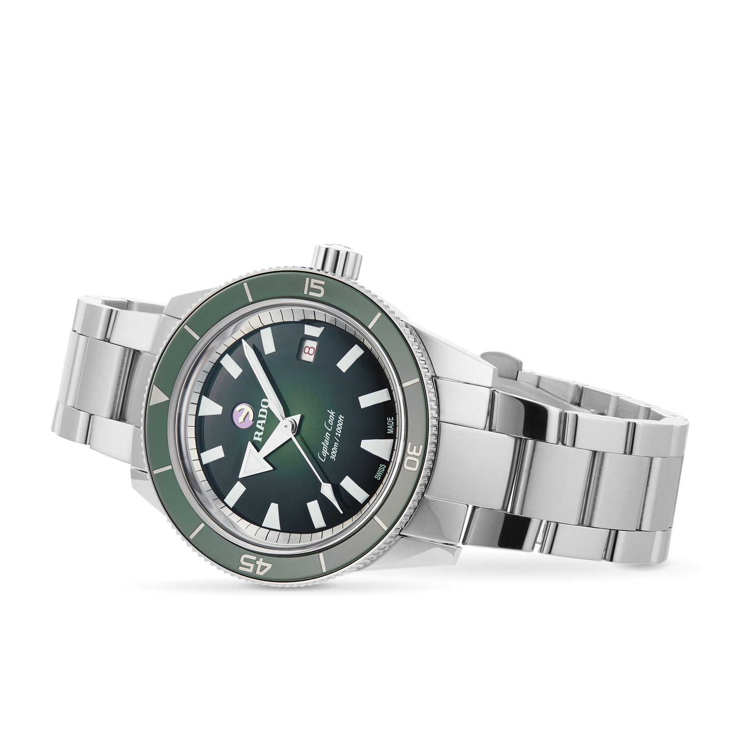 The Rado Captain Cook Automatic is a stainless steel wristwatch with a green bezel, black dial, date window at 3 o’clock, vintage details, and everyday water resistance.