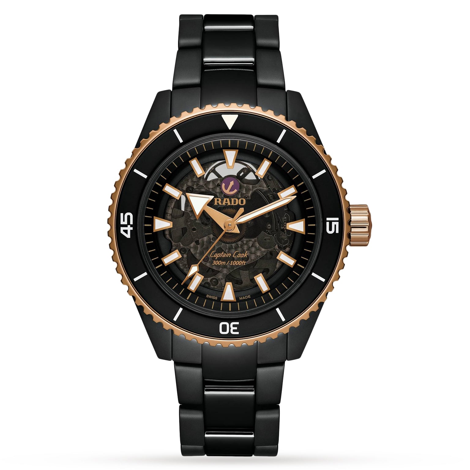 A Rado Captain Cook High-Tech Ceramic wristwatch with a black and gold skeleton dial, Nivachron™ hairspring, ceramic bezel, stainless steel bracelet, and displaying the time 10:10.