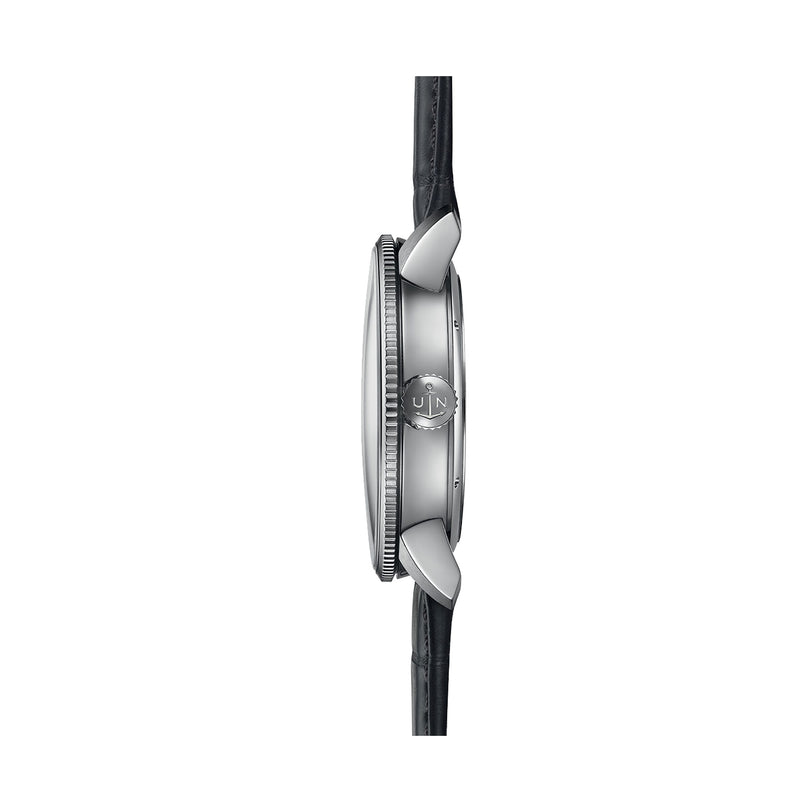 Side view of the Ulysse Nardin Marine Torpilleur wristwatch with a round silver case, logo-engraved crown, black leather strap, and elegant Roman numeral indexes on its dial.