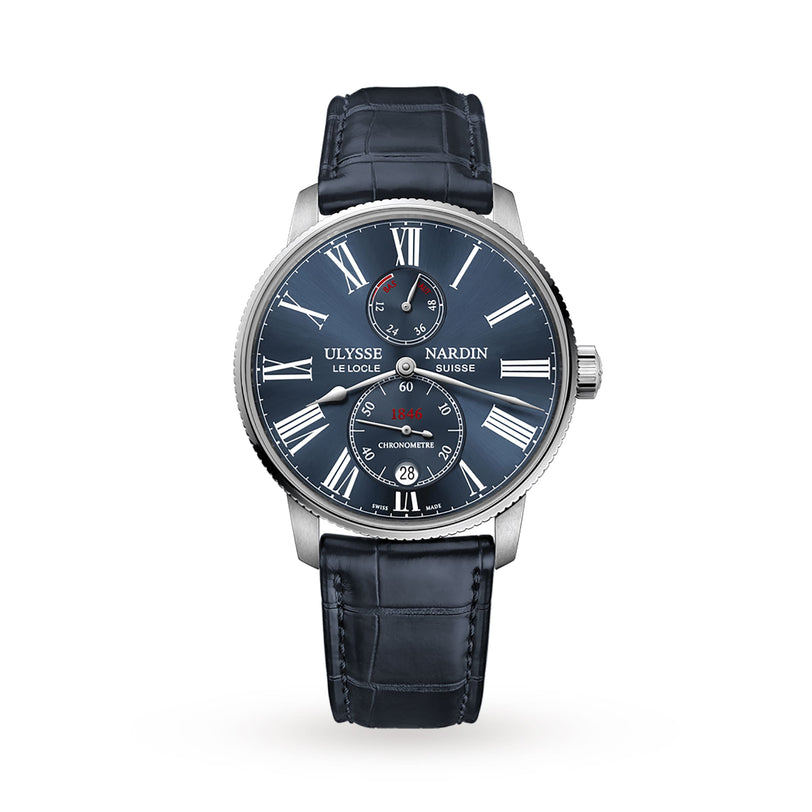 A Ulysse Nardin Marine Torpilleur wristwatch with a blue dial, Roman numerals, two subdials, and a blue leather strap is shown against a white background.