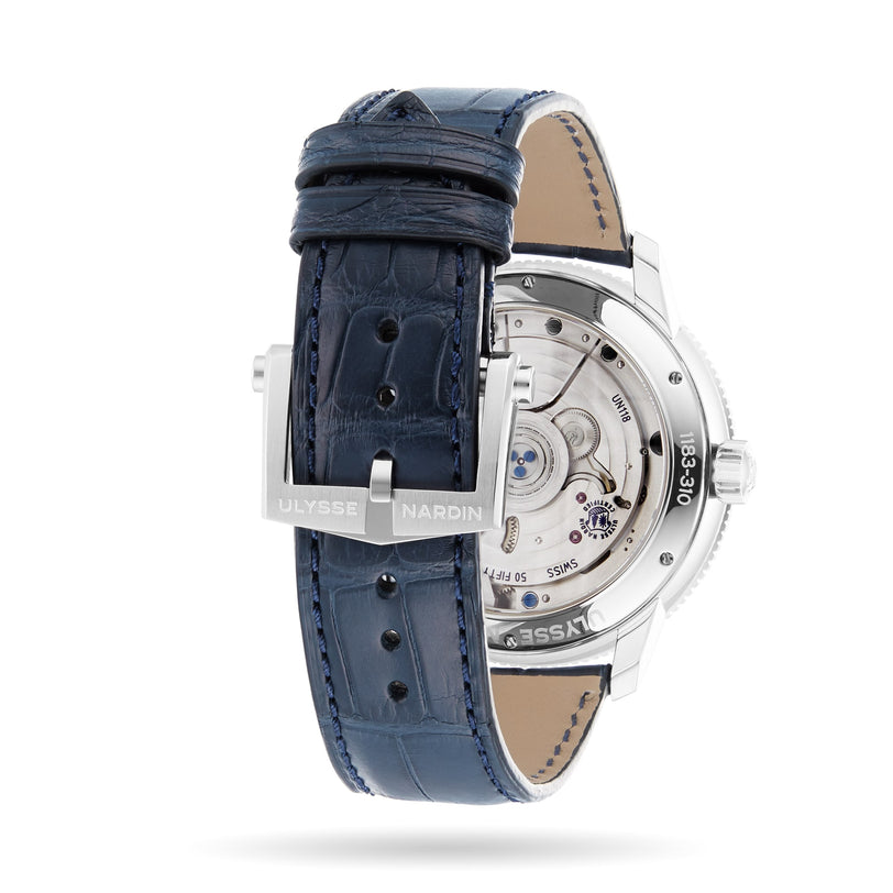 A close-up of the Ulysse Nardin Marine Torpilleur watch highlights its mechanical movement and branded clasp, paired with a blue leather strap.