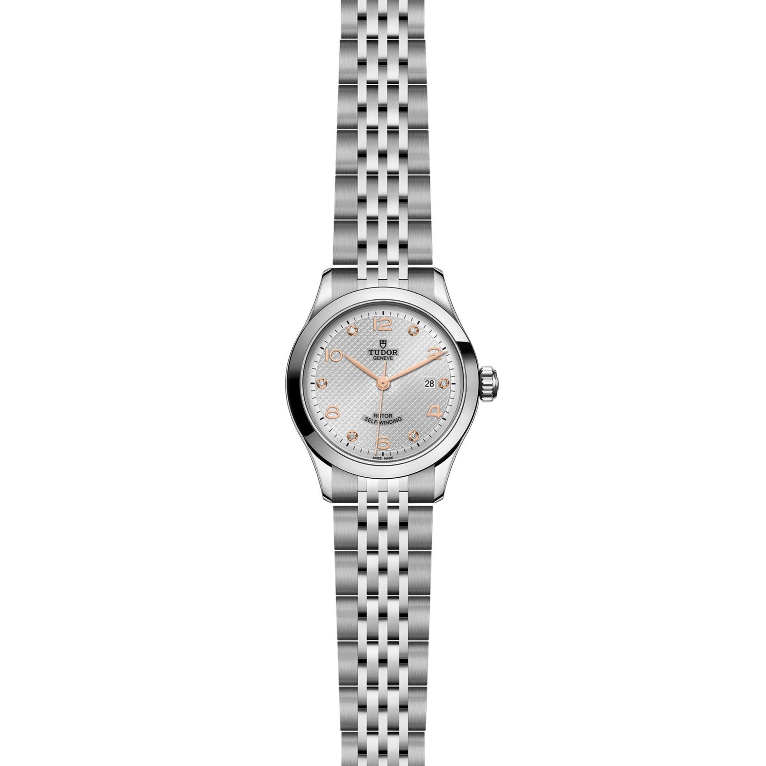 The TUDOR 1926 is a stainless steel wristwatch featuring a silver bracelet, round case, textured silver dial, gold hour markers and hands, date window at 3 o’clock, and precise self-winding movement.