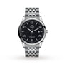 The TUDOR 1926 is a stainless steel wristwatch with a black textured dial, silver markers, date at 3 oclock, and a multi-link bracelet, all protected by a sapphire crystal lens.