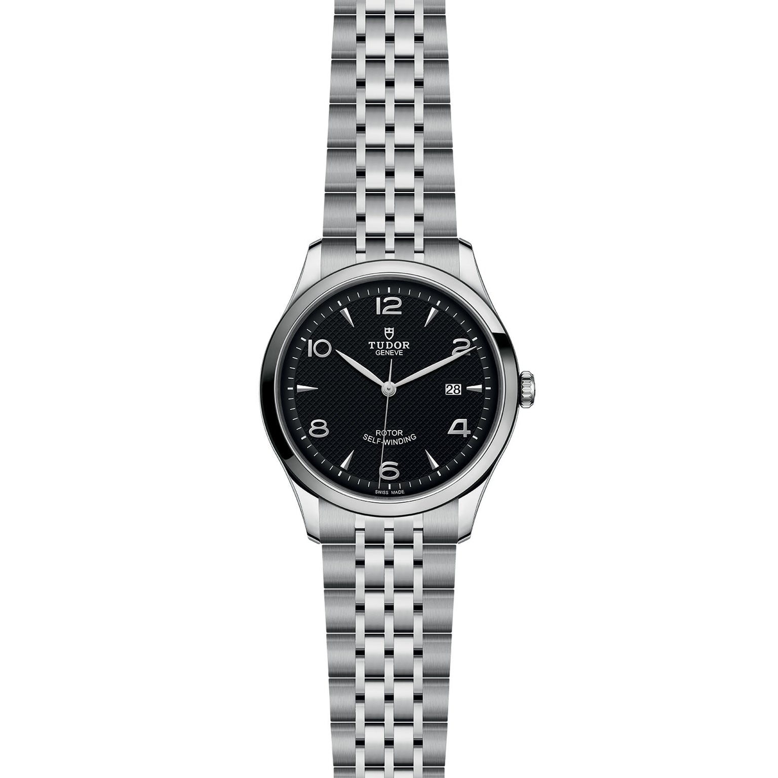 The TUDOR 1926 is a stainless steel wristwatch with a black dial, silver hour markers, a date window at 3 o’clock, a linked metal bracelet, and a durable sapphire crystal lens.