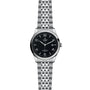 The TUDOR 1926 is a stainless steel wristwatch with a black dial, silver hour markers, a date window at 3 o’clock, a linked metal bracelet, and a durable sapphire crystal lens.