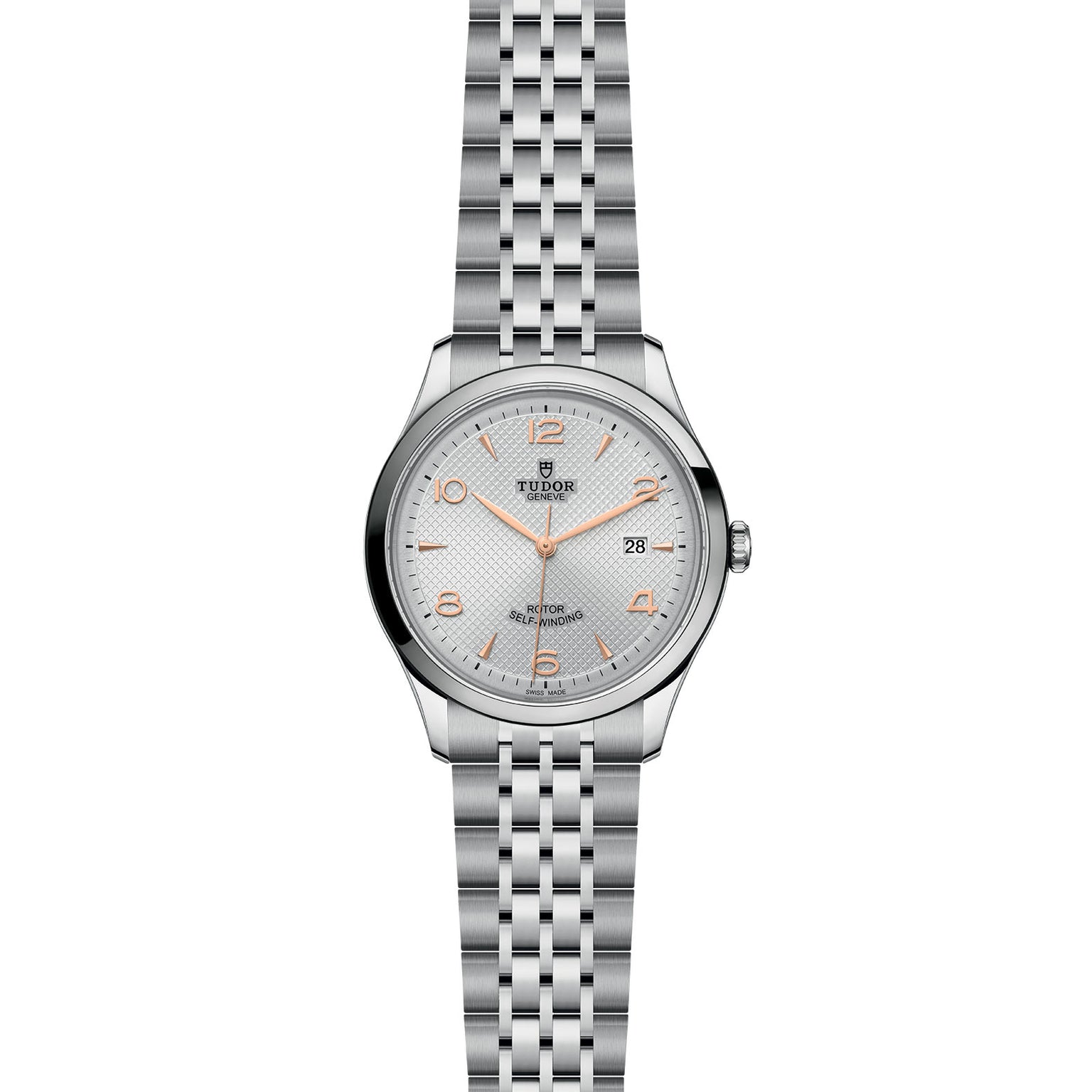 The TUDOR 1926 is a silver wristwatch featuring a metal link bracelet, white dial, gold-tone hour markers and hands, self-winding movement, and a date display at 3 o’clock.