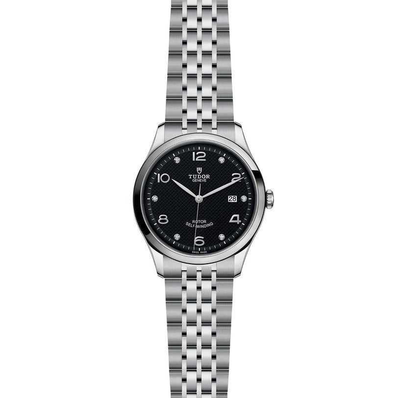 The TUDOR 1926 is a classic wristwatch featuring a black dial, silver hour markers, and a date window on a silver metal link bracelet—a timeless choice for any mechanical watch collection.