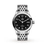 The TUDOR 1926 wristwatch, crafted in stainless steel with a black textured dial, silver hour markers, date at 3 o’clock, and a five-link bracelet, is displayed on a white background for mechanical watch enthusiasts.