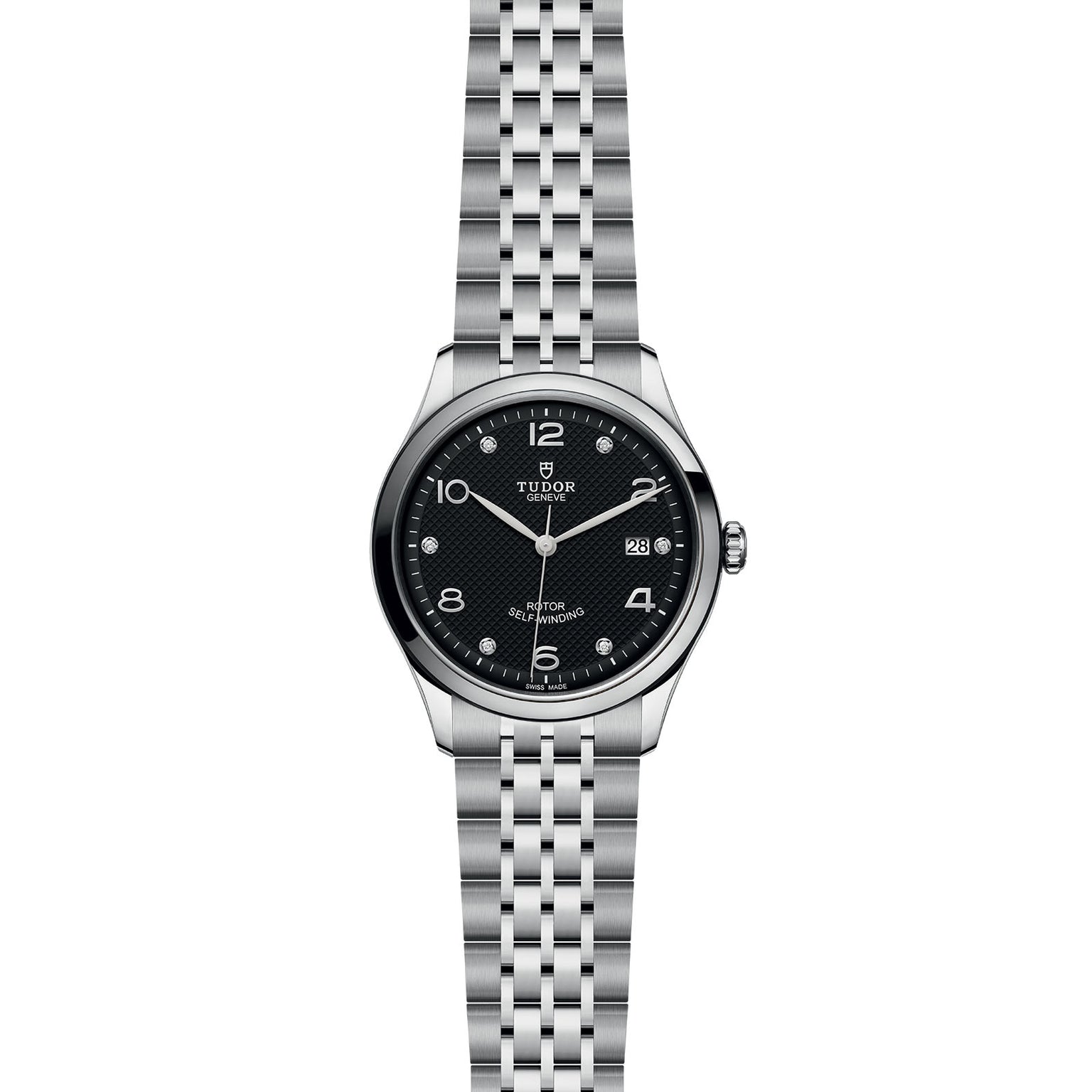 The TUDOR 1926 men’s watch features a silver case, black dial, silver numerals, date at 3 o’clock, and metal link bracelet—reflecting Hans Wilsdorf’s tradition of mechanical timepieces against a white background.