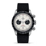 A TUDOR Black Bay Chrono wristwatch featuring a white dial, black subdials, tachymetric bezel, and a black fabric strap is displayed against a white background.