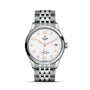 The TUDOR 1926 is a silver wristwatch with a white textured dial, gold hands and markers, date at 3 o’clock, and stainless steel bracelet—a timeless pick for mechanical watch enthusiasts.