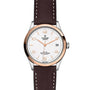 The TUDOR 1926 wristwatch features a white textured dial, gold-tone markers, date at 3 o’clock, brown leather strap, and a stainless steel and gold bezel—honoring the brand’s classic mechanical watch heritage.