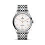 The TUDOR 1926 is a classic stainless steel wristwatch with a white textured dial, gold hour markers, date display at 3 o’clock, and a silver link bracelet—a timeless example of refined watchmaking.