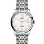 The TUDOR 1926 is a classic silver wristwatch featuring a white textured dial, rose gold hour markers, date window at 3 o’clock, and a metal link bracelet.