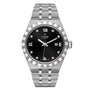 The TUDOR Royal is a stainless steel watch featuring a black dial with Roman numerals, diamond hour markers, a date window at 3 o’clock, and a metal link bracelet—perfect for a refined sport-chic look.