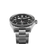 The TUDOR Pelagos 39 is a stainless steel wristwatch with a black bezel, black dial, white hour markers, and metal bracelet—expertly crafted for those who appreciate professional dive watches. Photographed against a white background.