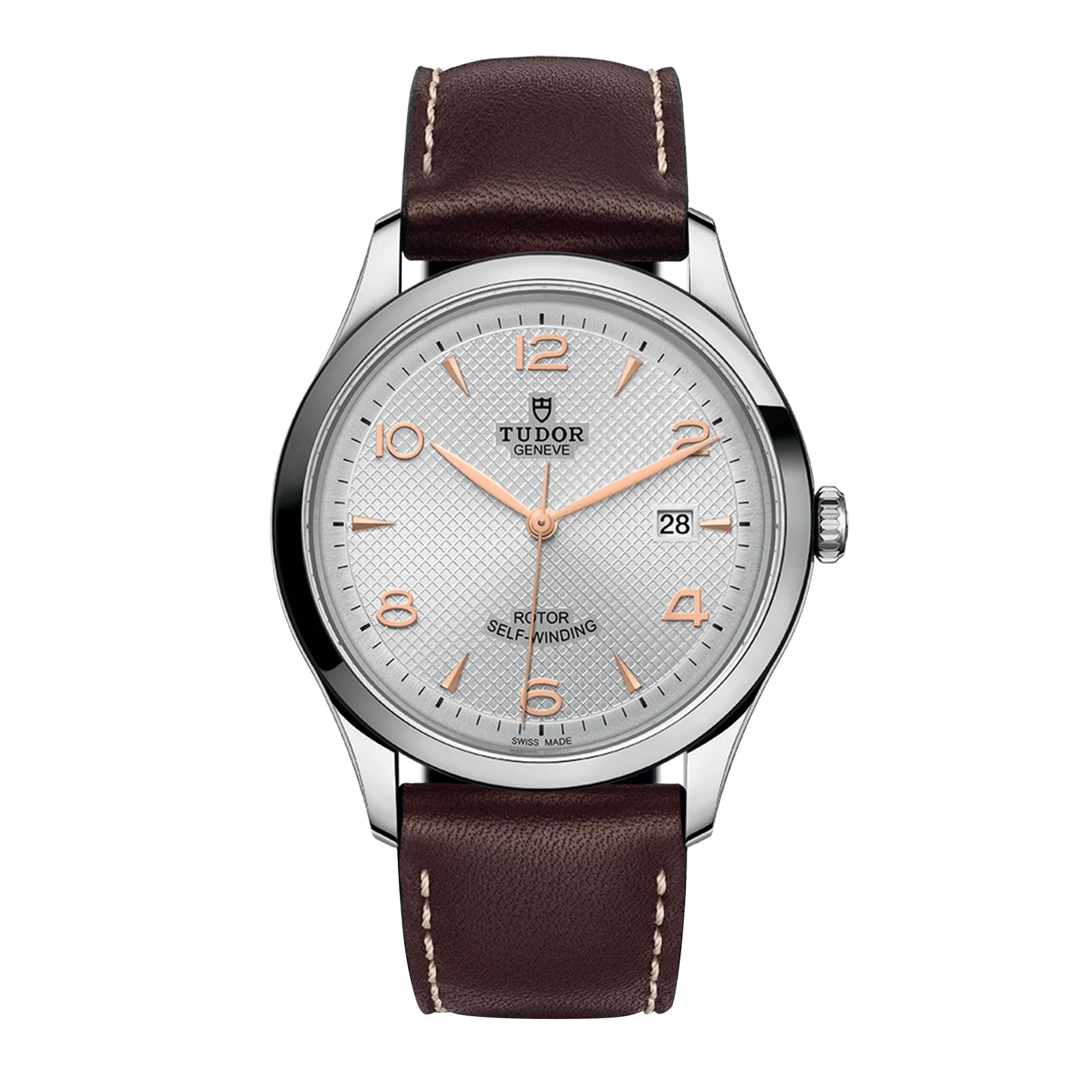 A TUDOR 1926 wristwatch featuring a brown leather strap, silver case, white textured dial, rose gold indices and hands, and a 3 o’clock date window—crafted by the brand founded by Rolex’s creator.