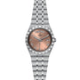 The TUDOR Royal is a stainless steel wristwatch featuring a pink dial with Roman numerals, day and date display, five-link bracelet, and automatic movement for a sport chic look.