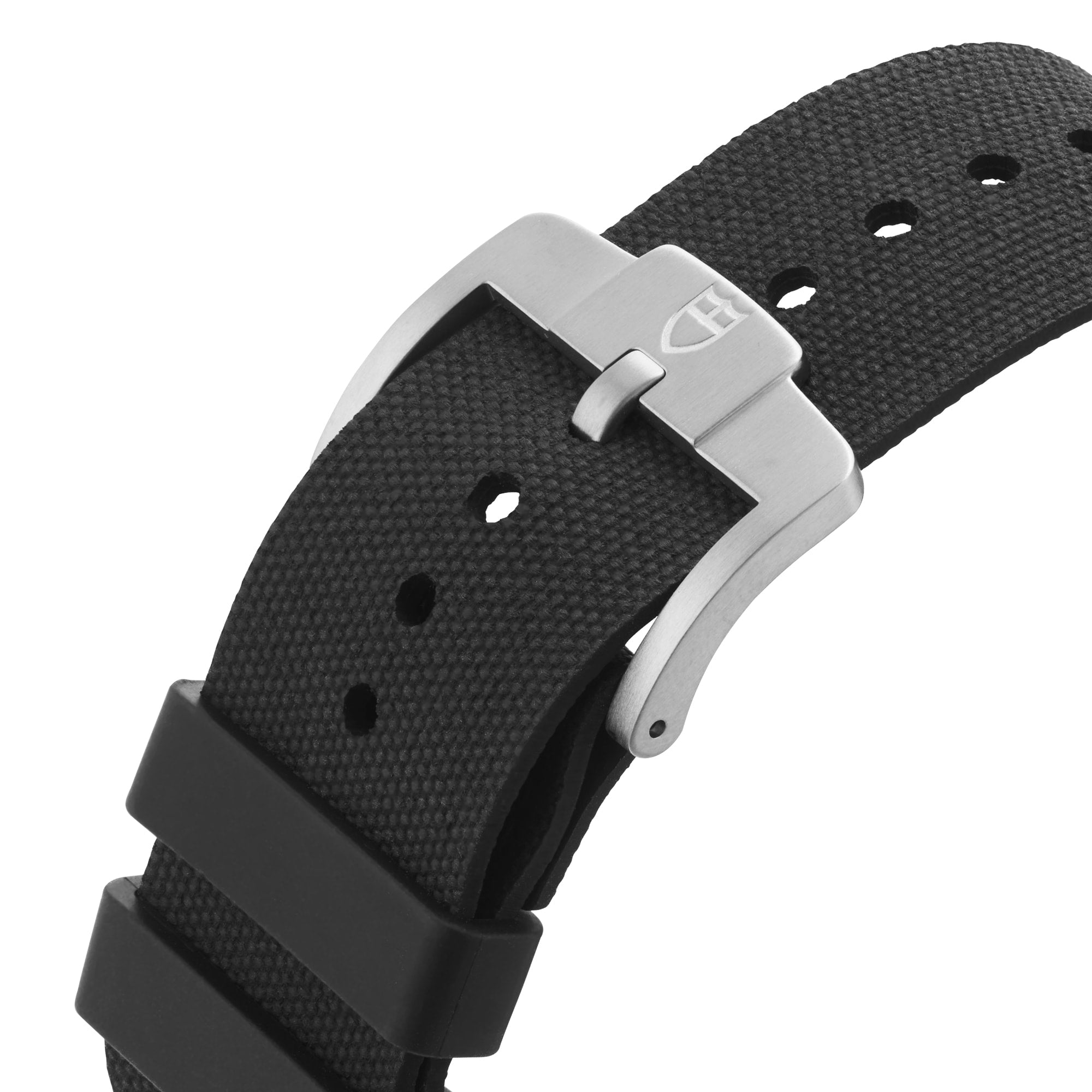 Close-up of a black textured strap with silver buckle, featuring TUDOR’s shield logo—an iconic detail on their diving watches like the Pelagos FXD.