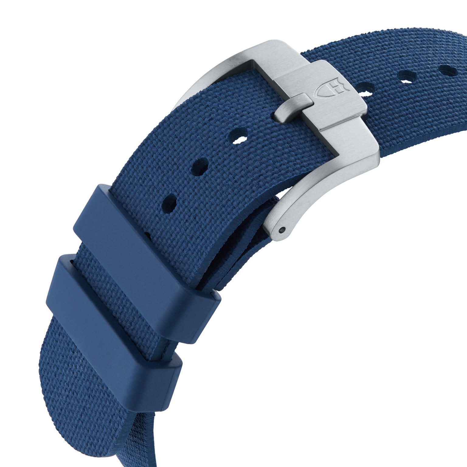 Close-up of the TUDOR Pelagos FXD’s blue textured strap, featuring a silver buckle and two loops.