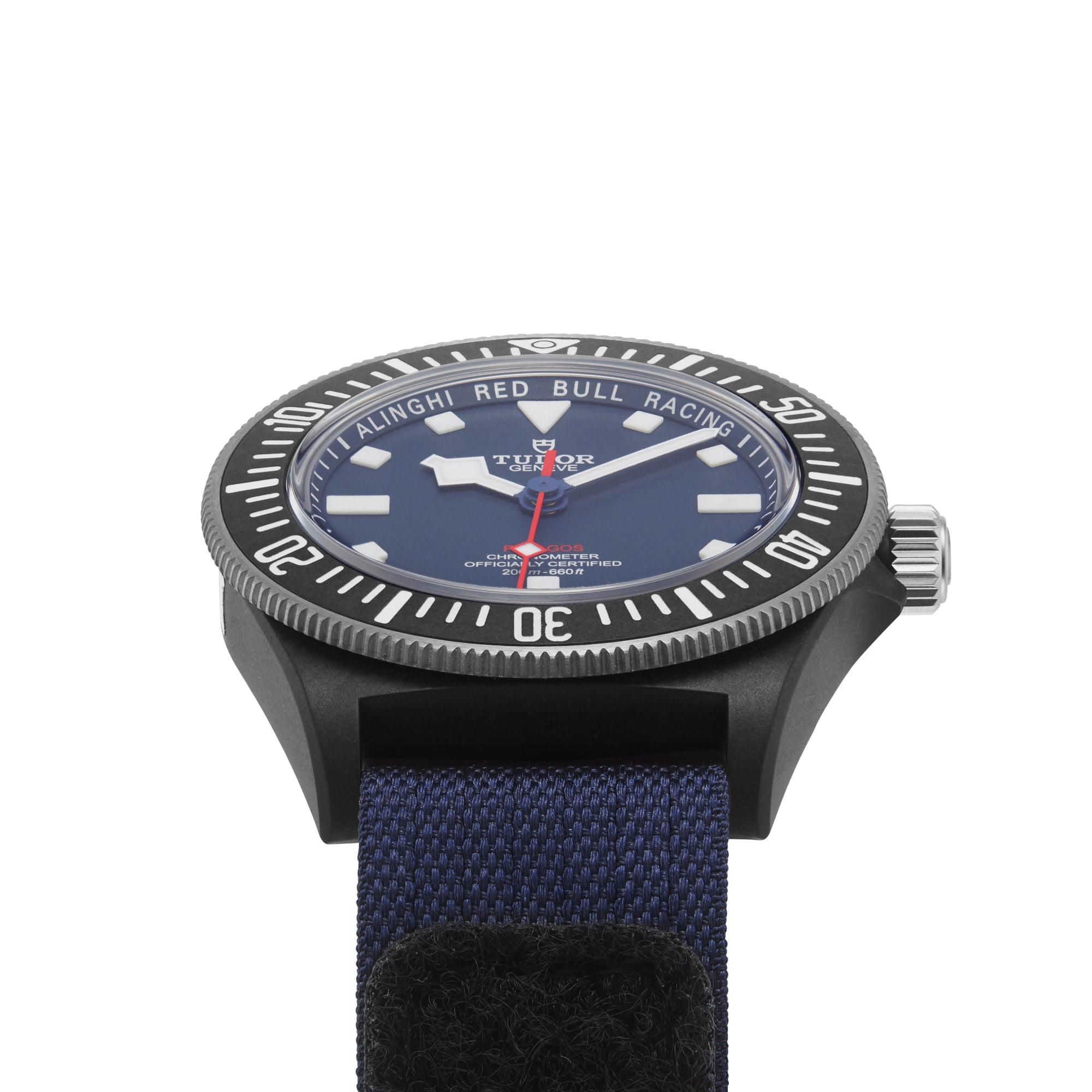 A close-up of the TUDOR Pelagos FXD, featuring a blue dial in a black case with a blue fabric strap—engineered for waterproof performance and precise underwater navigation.