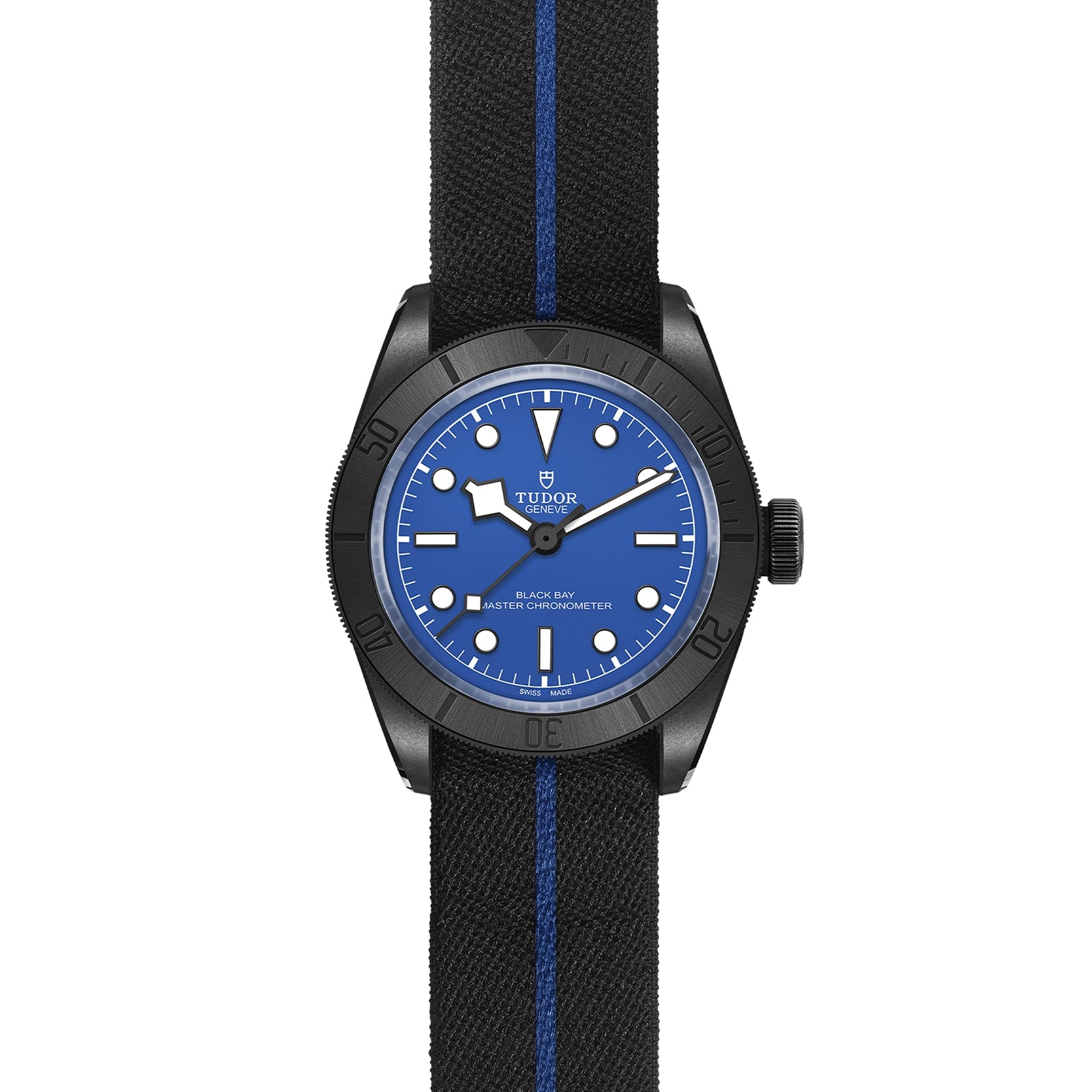 The TUDOR Black Bay Ceramic Blue wristwatch features a blue dial, black bezel, Snowflake hands, and a black fabric strap with a blue center stripe, honoring TUDOR divers’ watch heritage.