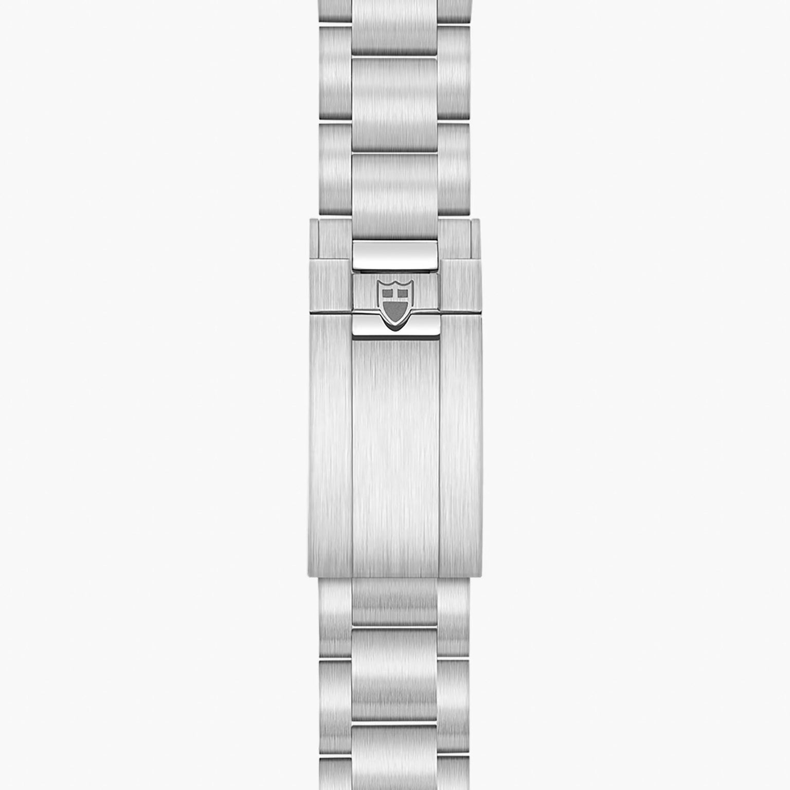 The TUDOR Black Bay 68 features a silver metal bracelet with a brushed finish and a clasp adorned with the brand’s shield logo at the center.
