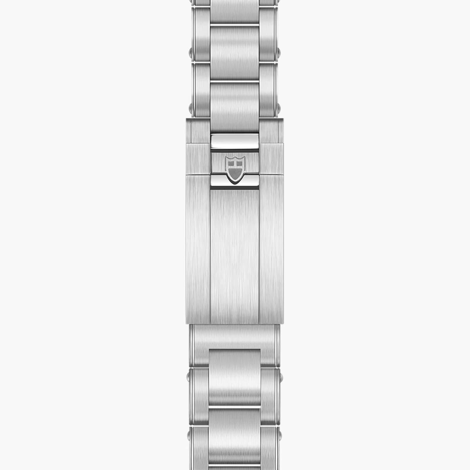 Close-up of the TUDOR Black Bay Chronos stainless steel bracelet clasp, featuring an engraved shield logo.
