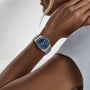 TUDOR Royal watch with blue dial and stainless steel bracelet worn on wrist.