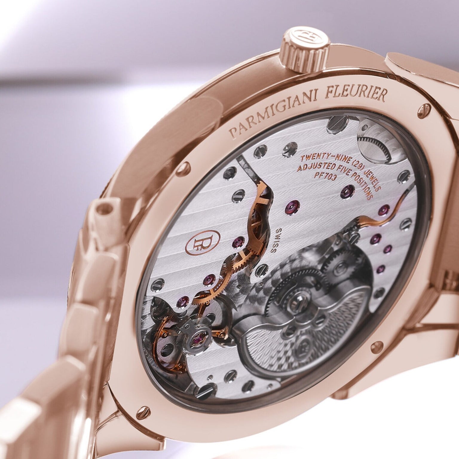 Close-up of the intricate back mechanism of the Parmigiani Fleurier TONDA PF Micro-Rotor luxury wristwatch in rose gold.