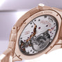 Close-up of the intricate back mechanism of the Parmigiani Fleurier TONDA PF Micro-Rotor luxury wristwatch in rose gold.
