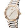 The Parmigiani Fleurier TONDA PF Automatic is a two-tone wristwatch with a gold bezel, silver and gold metal band, and a simple cream dial.