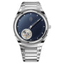 Parmigiani Fleurier TONDA PF Flying Tourbillon: silver wristwatch featuring a blue dial, open tourbillon at 6 o’clock, and a metal link bracelet.