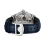 The IWC Schaffhausen Portugieser Automatic, featuring a visible mechanical movement and blue leather strap, is shown with its case back facing forward to highlight its engineering excellence.