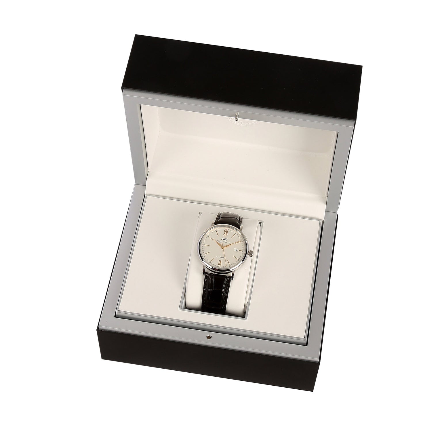 The IWC Schaffhausen Portofino Automatic, featuring a 40mm stainless steel case and black alligator leather strap, is displayed in an open black and white presentation box.