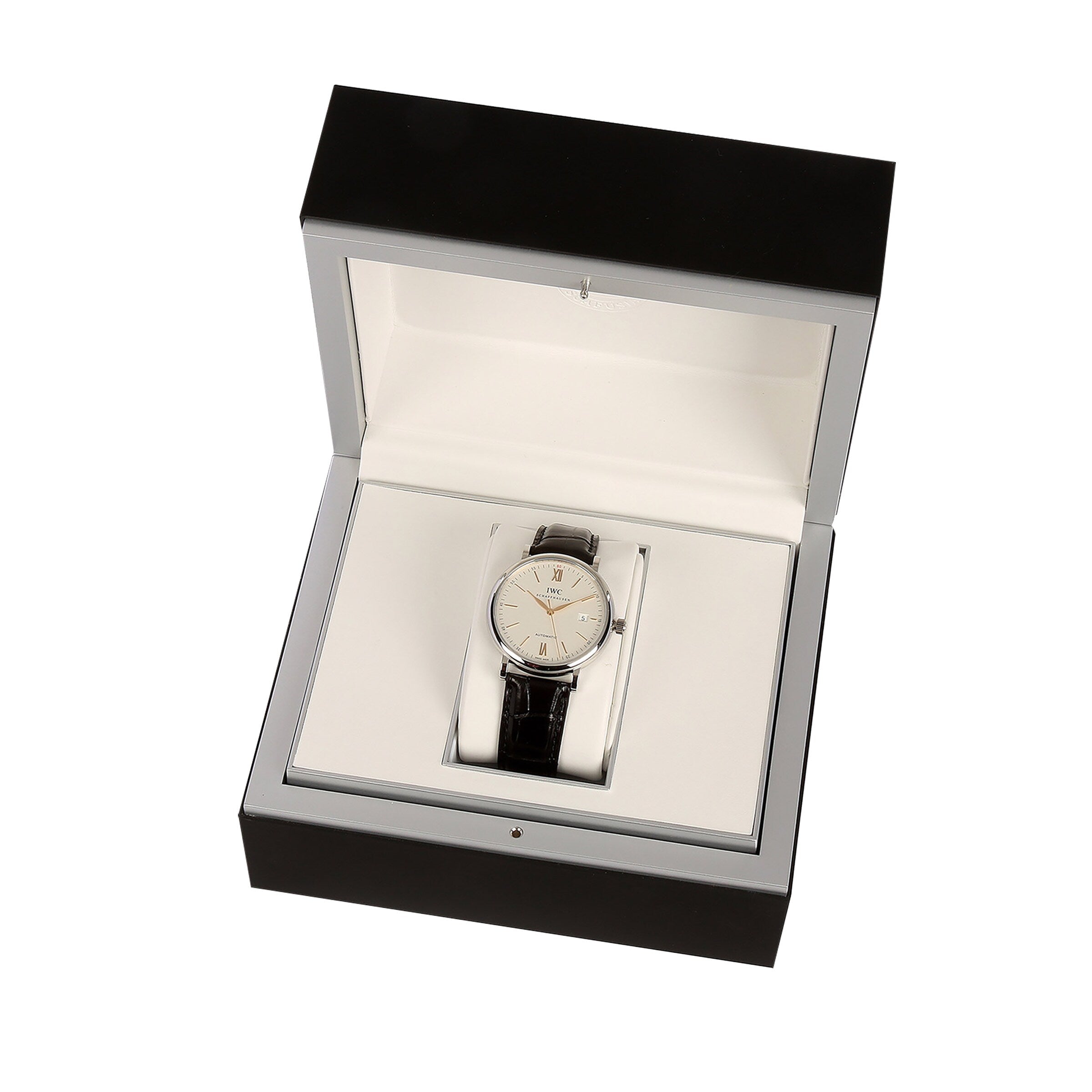 The IWC Schaffhausen Portofino Automatic, featuring a 40mm stainless steel case and black alligator leather strap, is displayed in an open black and white presentation box.