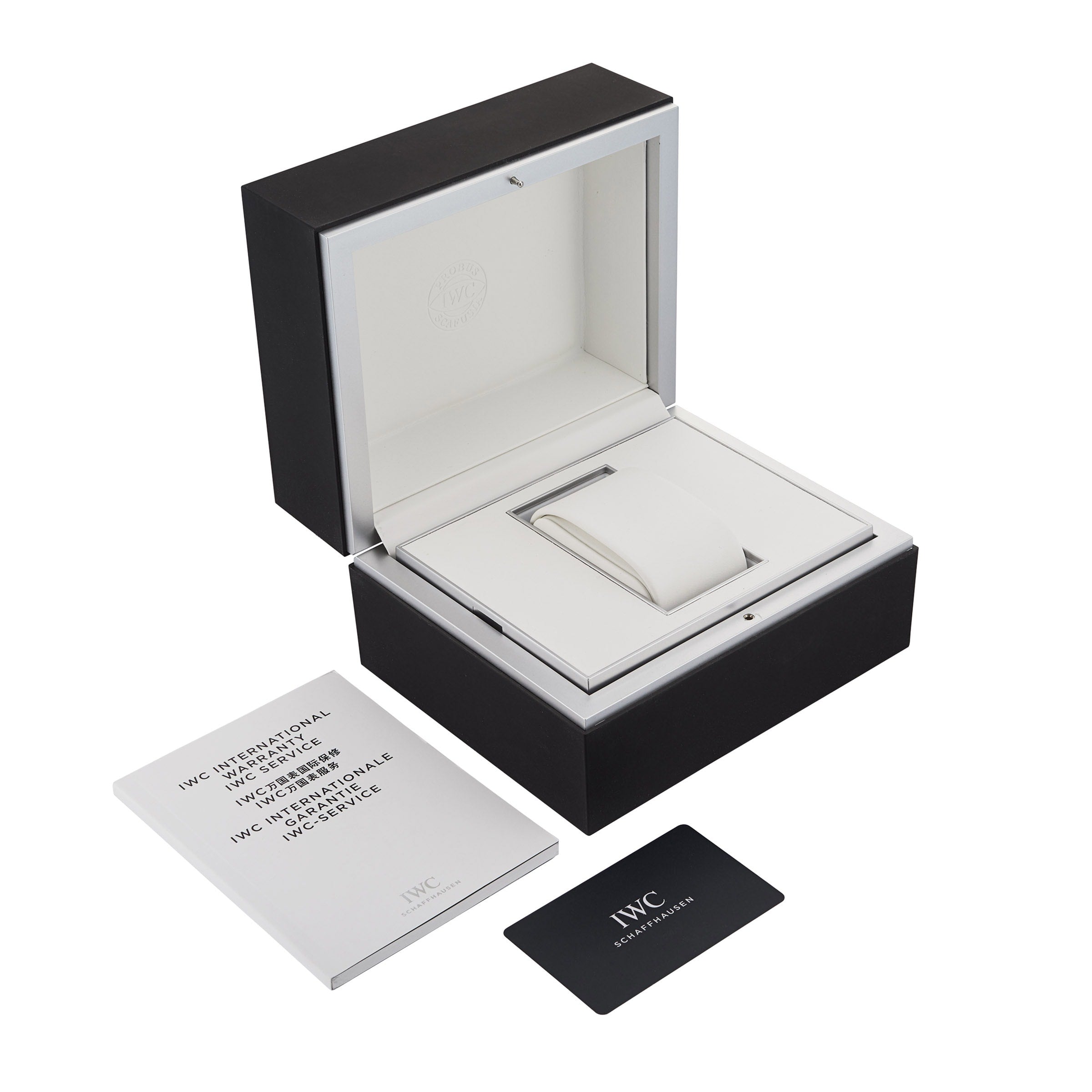 Black and white IWC Schaffhausen Portofino Hand-Wound Eight Days watch box with open lid, a white booklet, and a black IWC warranty card placed beside it on a white background—ideal for displaying your luxury timepiece.
