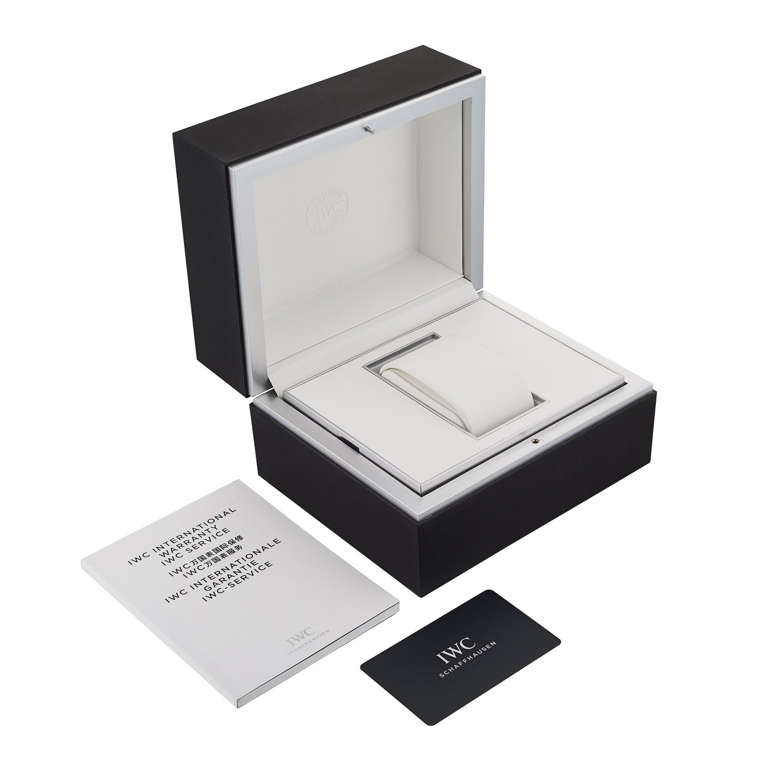 Open black and white IWC Schaffhausen watch box with cushion, white booklet, and black warranty card—perfect for your Portugieser Chronograph or any IWC automatic watch, all displayed on a clean white background.