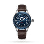 The IWC Schaffhausen Pilots Watch Timezoner Edition Le Petit Prince features a blue dial, automatic movement, brown leather strap, stainless steel case, white numerals, city names on the bezel, and a date window at 3 o’clock.