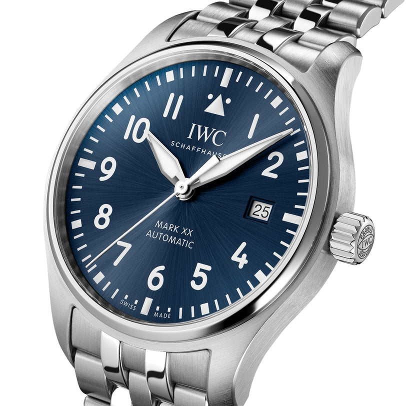 Close-up of the IWC Schaffhausen Pilots Watch Mark XX, an aviation timepiece with a blue dial, white numerals, stainless steel bracelet, and date set to the 25th.