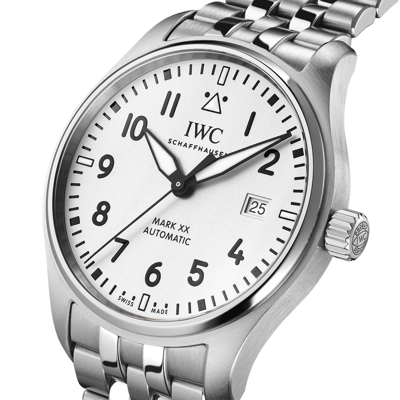 IWC Schaffhausen Pilot’s Watch Mark XX featuring a silver case, white dial with black numerals, date window, and stainless steel bracelet.