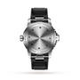 The image shows the back of an IWC Schaffhausen Aquatimer Automatic wristwatch with “International Watch Co” engraved, a black rubber strap, and stainless steel case back specifications.