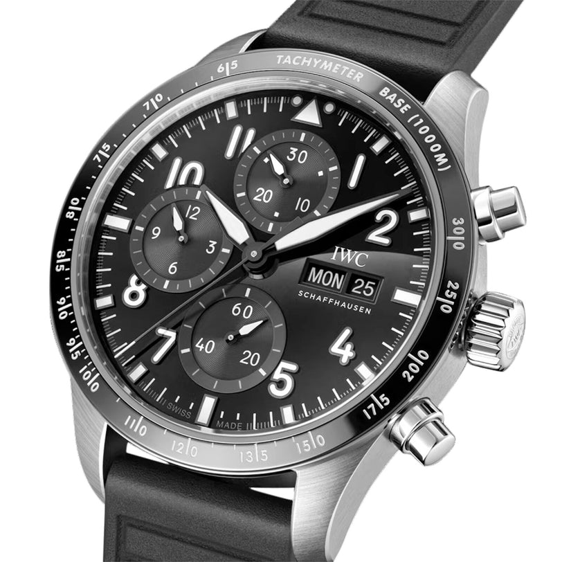 Close-up of the IWC Schaffhausen Pilots Watch Performance Chronograph 41 AMG, featuring a black dial with three subdials, sapphire glass, tachymeter scale, and black rubber strap. The automatic watch displays 10:08 on Monday the 25th.