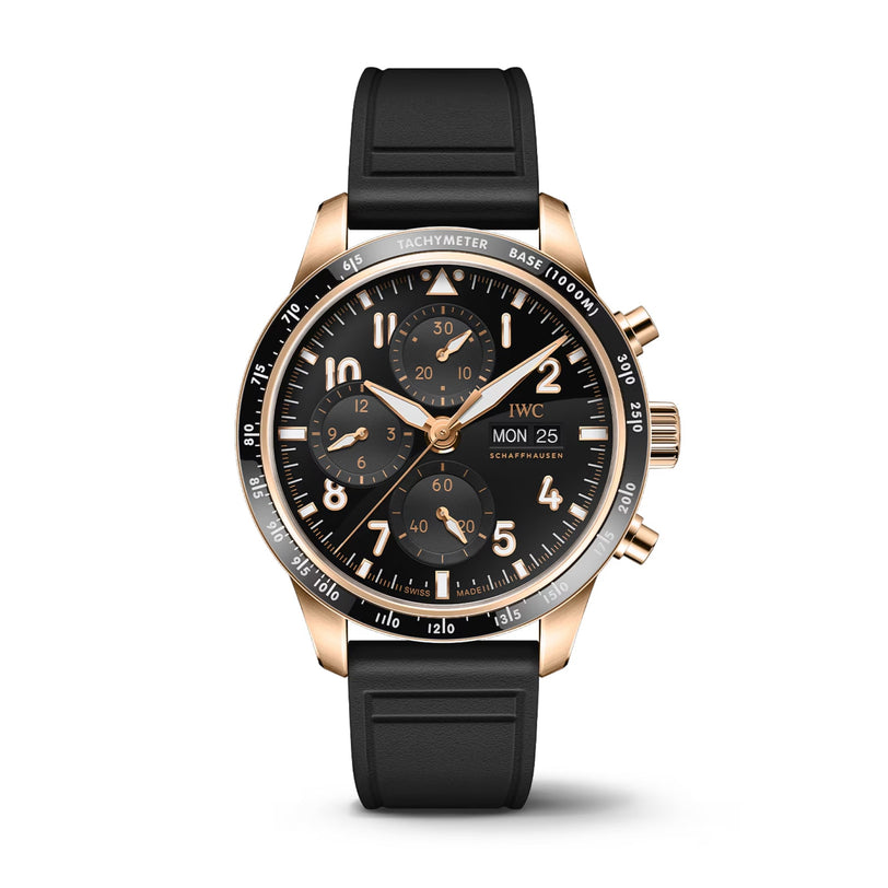 The IWC Schaffhausen Pilots Watch Performance Chronograph 41 in 18-carat gold features a black dial with three sub-dials, date display, tachymeter bezel, and a black rubber strap, presented on a white background.